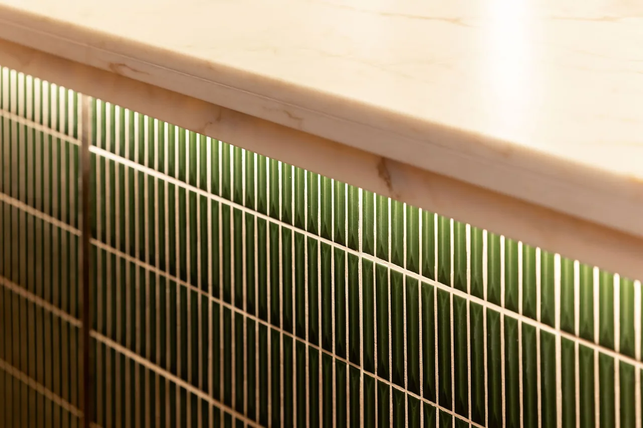 Detail of the green tiled bar counter